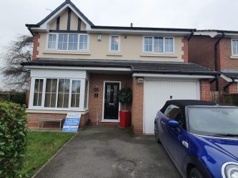 Full roofline replacement with white fascias, soffits and black guttering