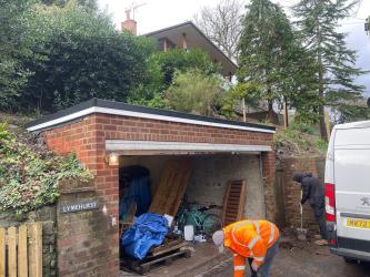 Detached garage flat roof replacement with new rubber membrane, fascias and edge trims