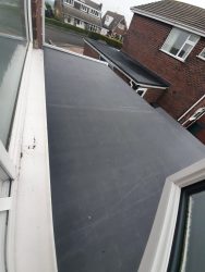 Seamless EPDM rubber roof membrane installed in one piece on a single storey extension