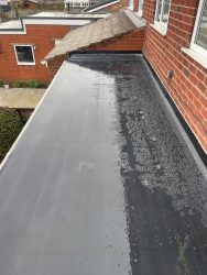 Long side extension EPDM flat roof with white edge fascia and clean membrane finish